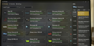 [IMAGE: Supplier test account loaded in TiviMate showing EPG guide and channel category structure]